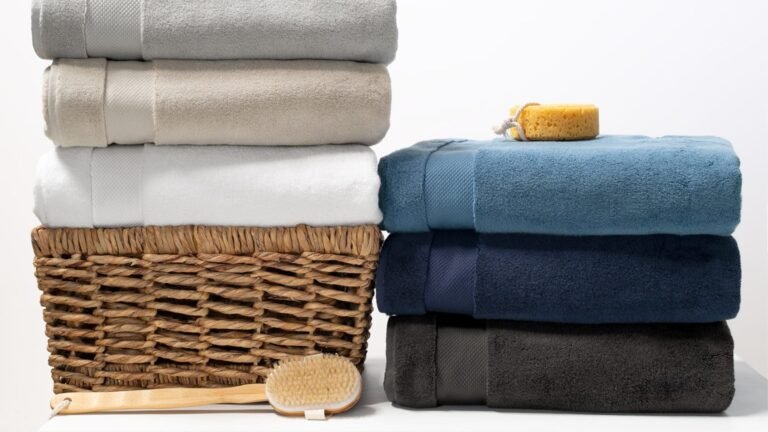 Freshly cleaned sheets, pillowcases, and towels folded for a short-term rental