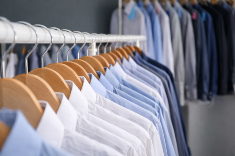 Professionally dry cleaned suits and dresses hanging neatly in New York